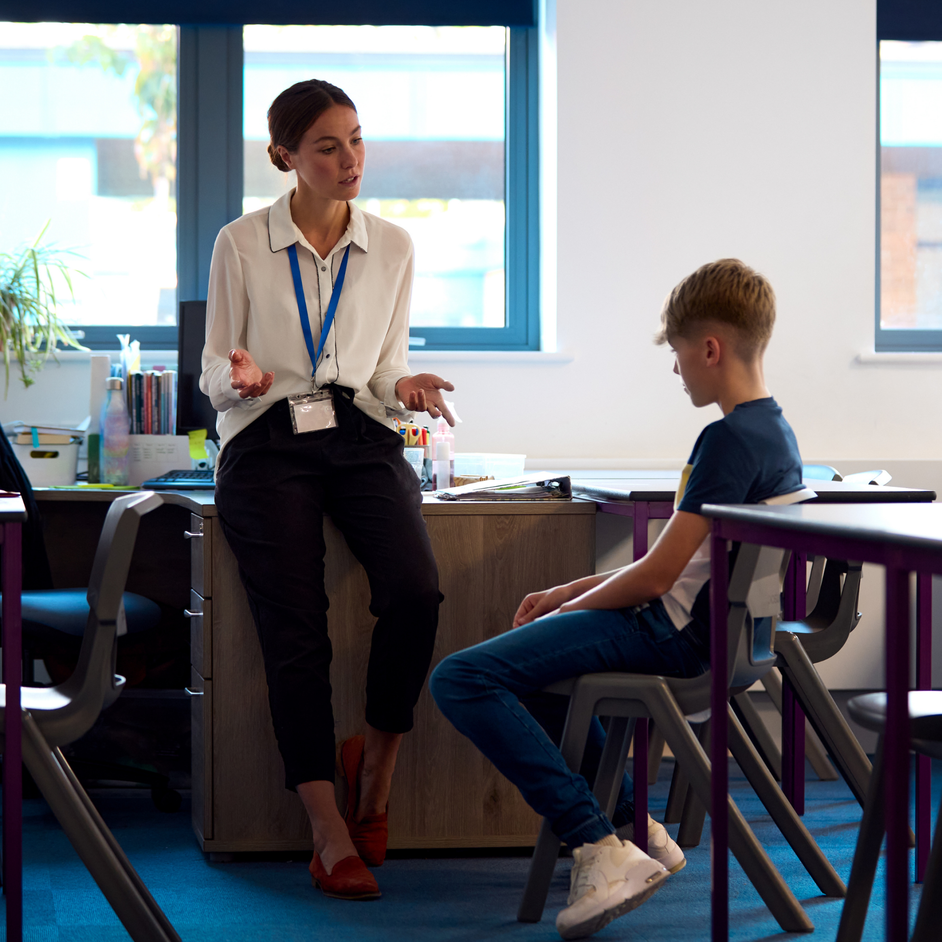Teacher talking to student
